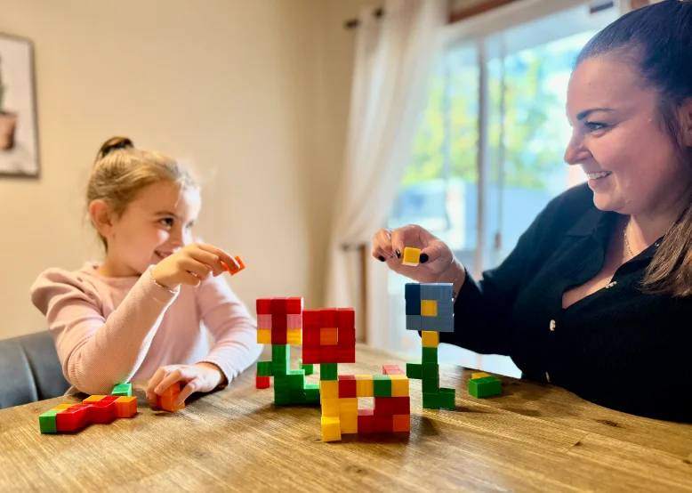 Parents and teachers playing with Click Cube